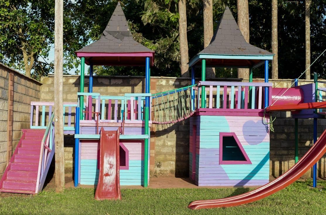 A children's play area with towers and slides